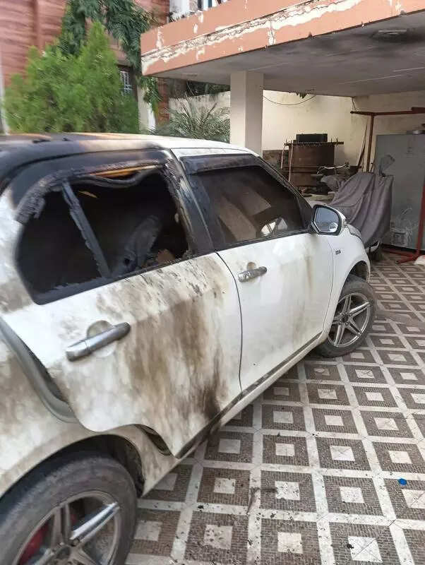 Truck union president survives gunfire attack after car set on fire