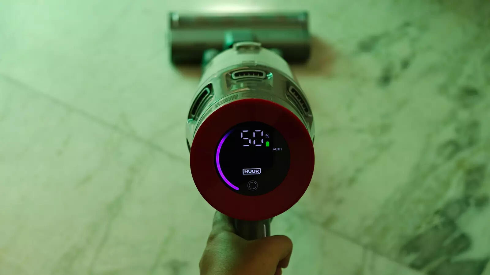 The screen on the top shows the charge left, suction power, and mode