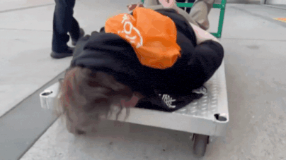 'Refuse to walk? We’ll give you a ride': ICE officials cuff and wheel protester away on cart – Watch