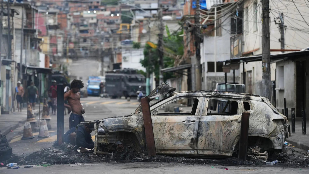 Brazilian police accused of hanging teen gangster’s head ‘like a trophy’ in anti-drug raid that killed over 120
