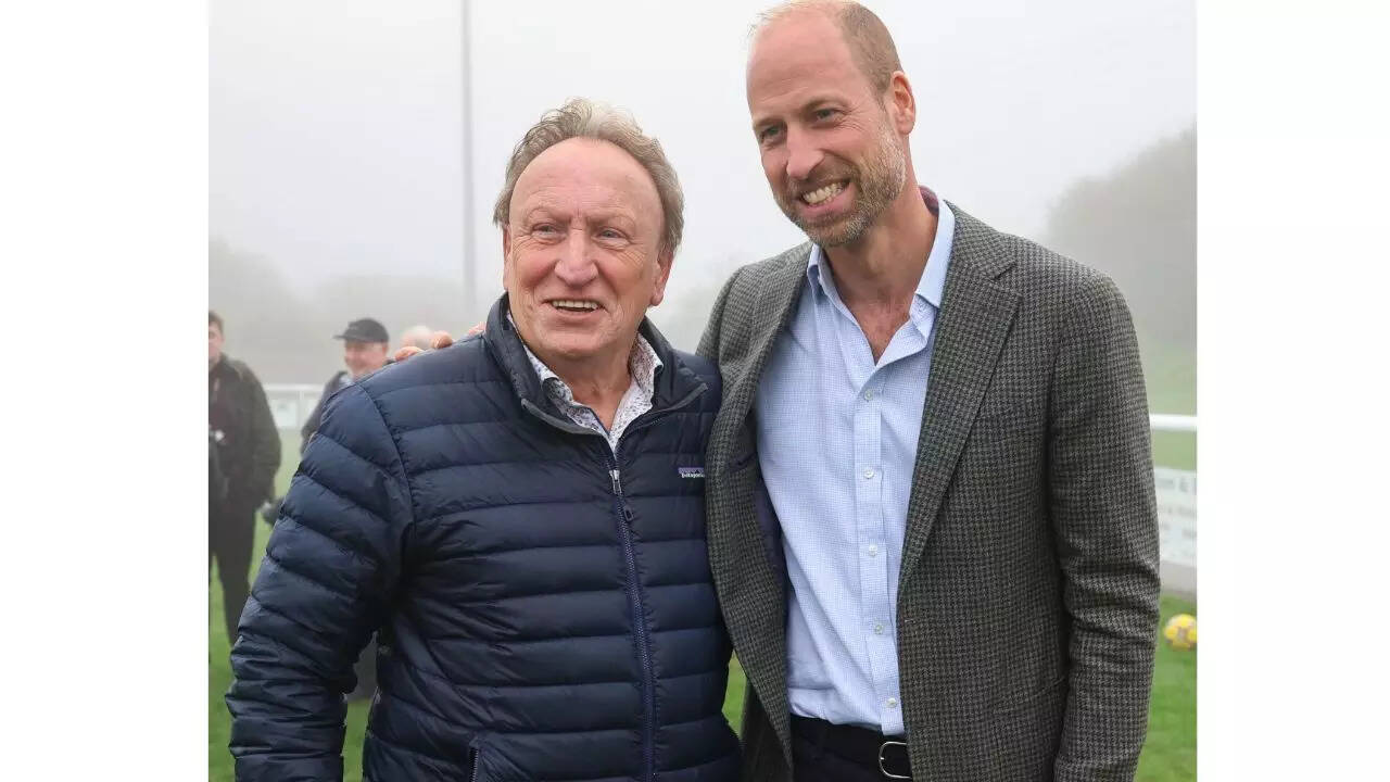 ‘Fan’ Prince William poses with football legend Neil Warnock after helping a local club secure a new road