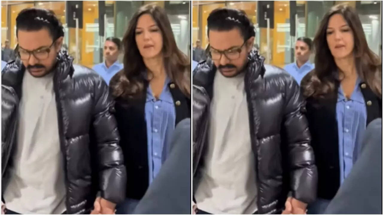Aamir and Gauri walk hand-in-hand at airport