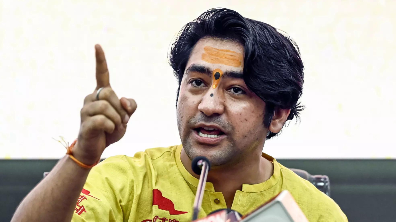 Congress slams video of Bageshwar Dham head on govt plane, cop touching feet