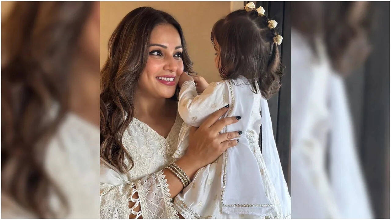 Bipasha Basu gets angry at Paparazzi, shields Devi's face