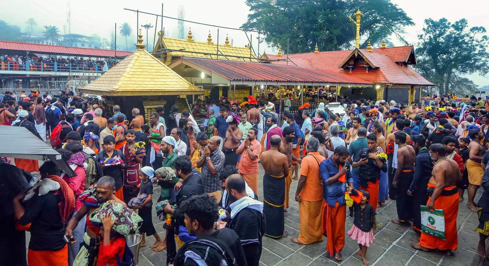 Sabarimala_ Lord Ayyappa devotees wait to perform prayers during Chingam 1 or Ma....