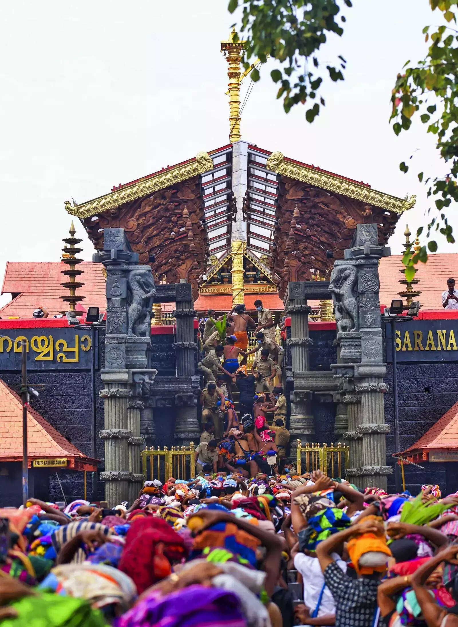 Pathanamthitta_ Devotees climb the 18 steps to worship Lord Ayyappan at the Saba....