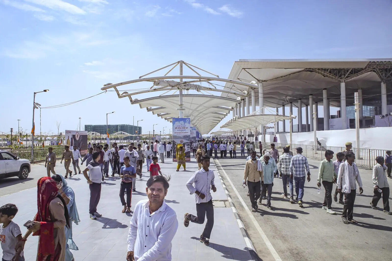 People gather at the newly constructed Noida International Airport after its inauguration
