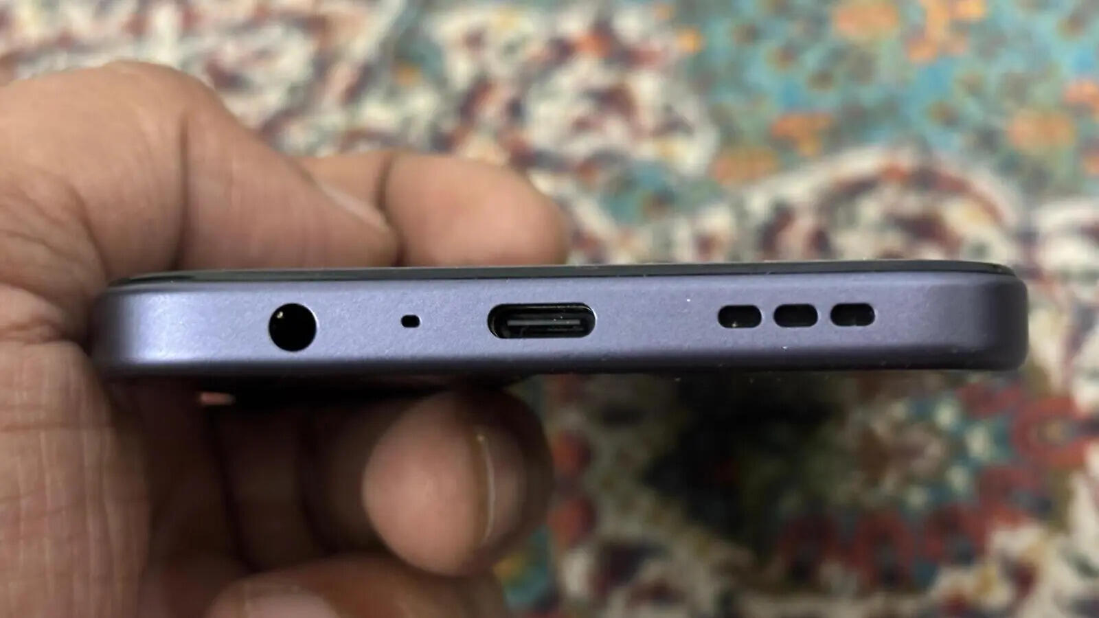 USB Type-C charging port, 3.5 audio port and speaker grille