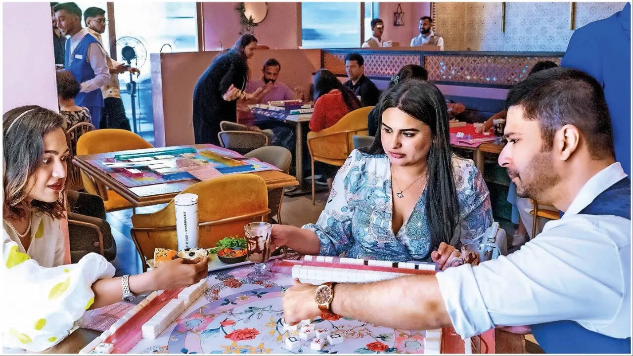 Players enjoy a game of Mahjong