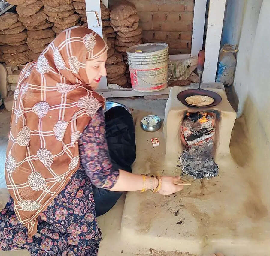 Savita uses a wood-fired stove for cooking at her home in Harola, after she ran out of gas Savita uses a wood-fired stove for cooking at her home in Harola, after she ran out of gas