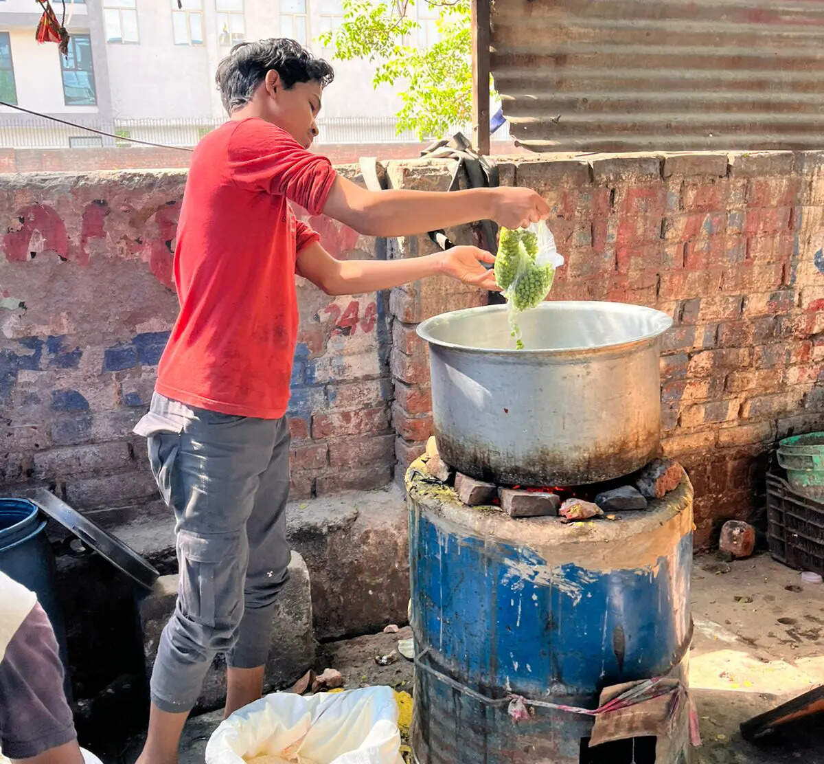 Workers at Raju Sahu's shop have been cooking on a coal kiln for 20 days after their gas cylinder ran out