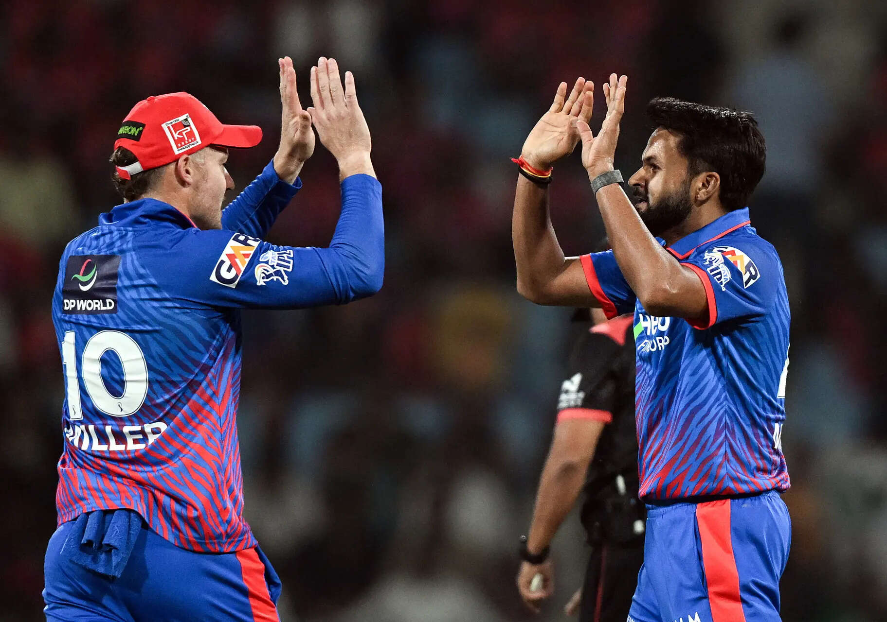 Lucknow, Apr 01 (ANI): Delhi Capitals' Mukesh Kumar and David Miller celebrate t...