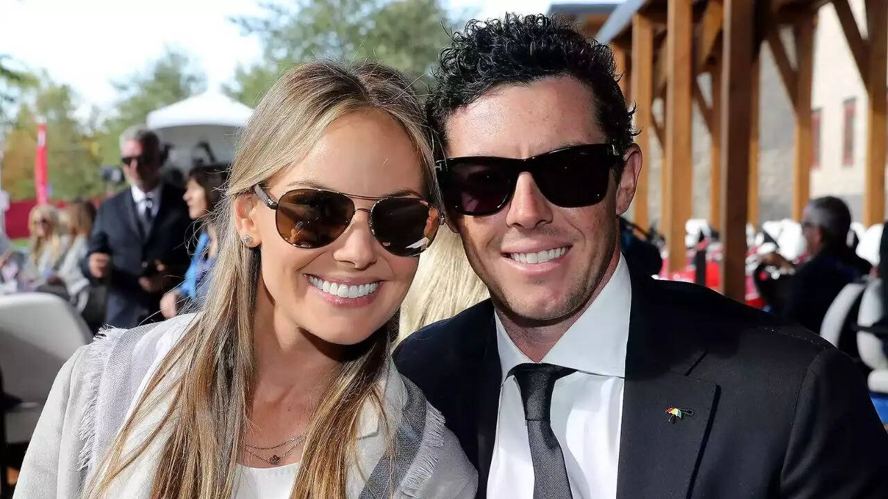 David Cannon/ Getty Images Rory McIlroy and Erica Stoll