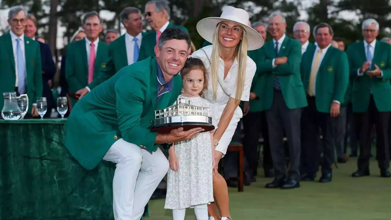 Richard Heathcote/ Getty Images Rory McIlroy with his daughter, Poppy, and his wife, Erica Stoll