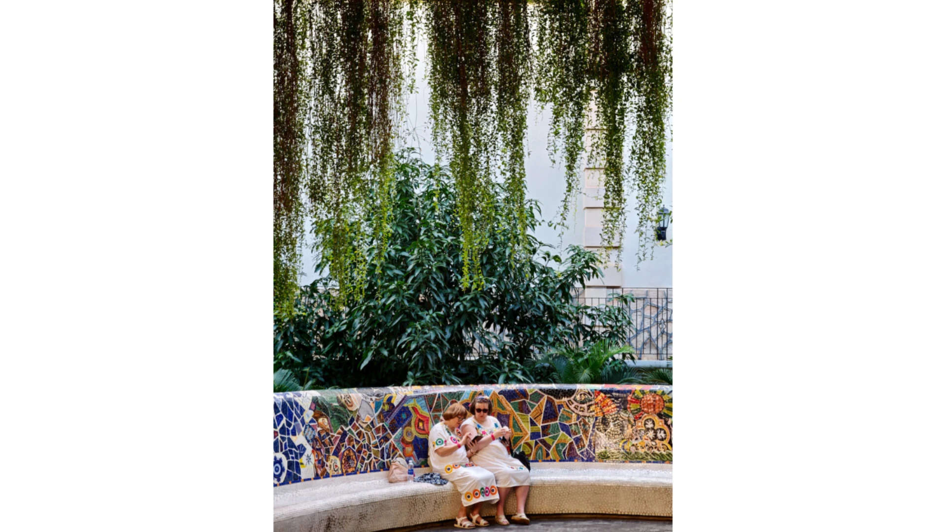 Two women on mosaic bench