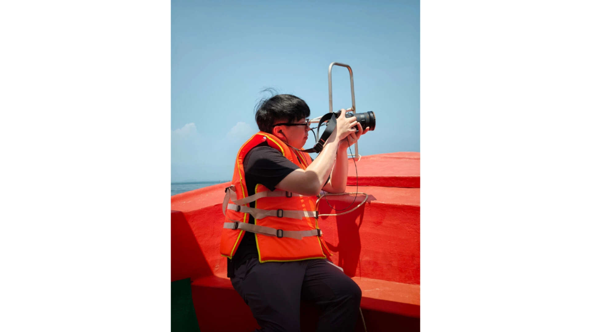 A boatside photographer