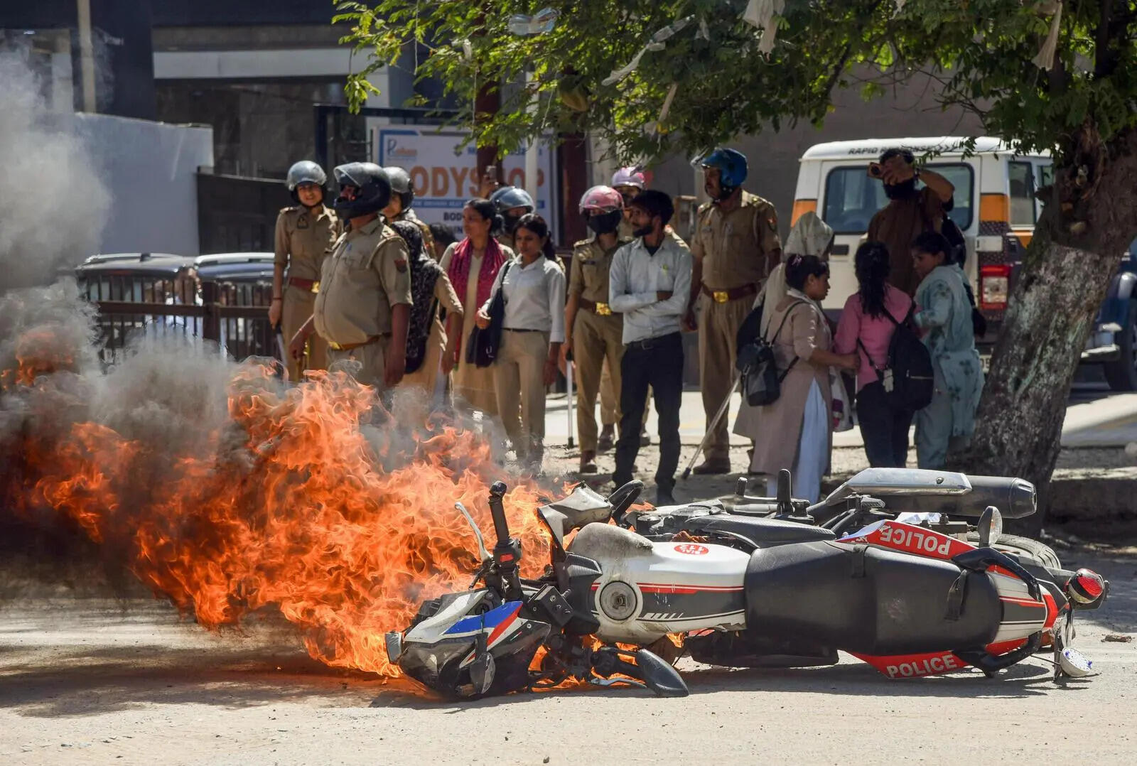 A police bike torched during the protest