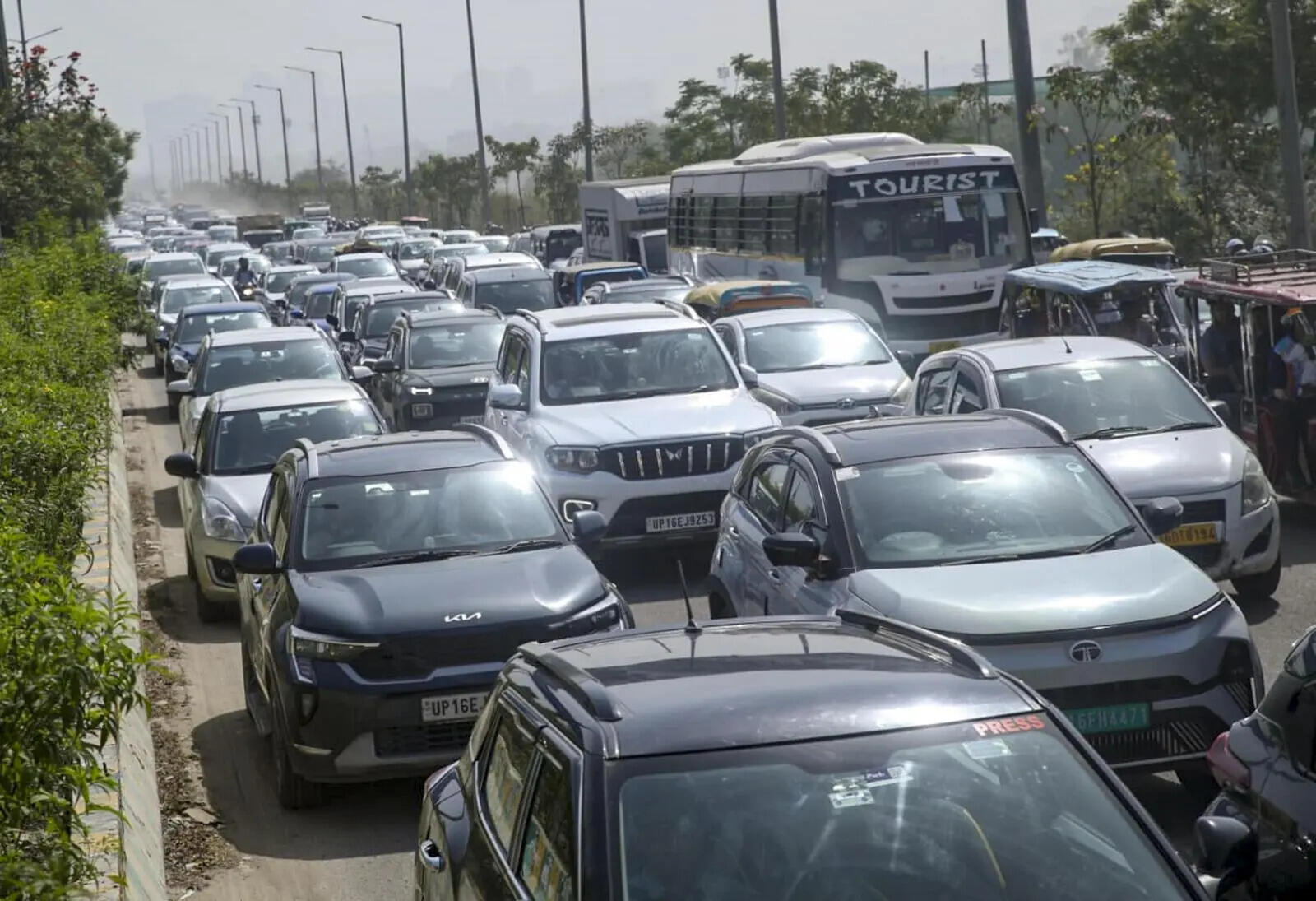 Vehicles stuck in a traffic jam as factory workers stage protest