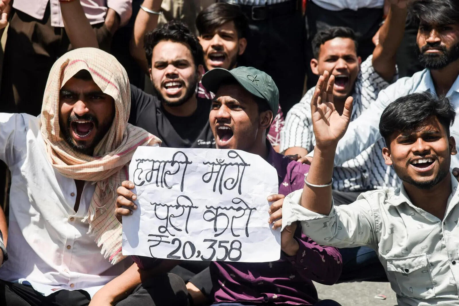 Noida, Apr 13 (ANI): Employees of a company protest demanding a salary increment, in Noida on Monday. (ANI Photo/Sumit)