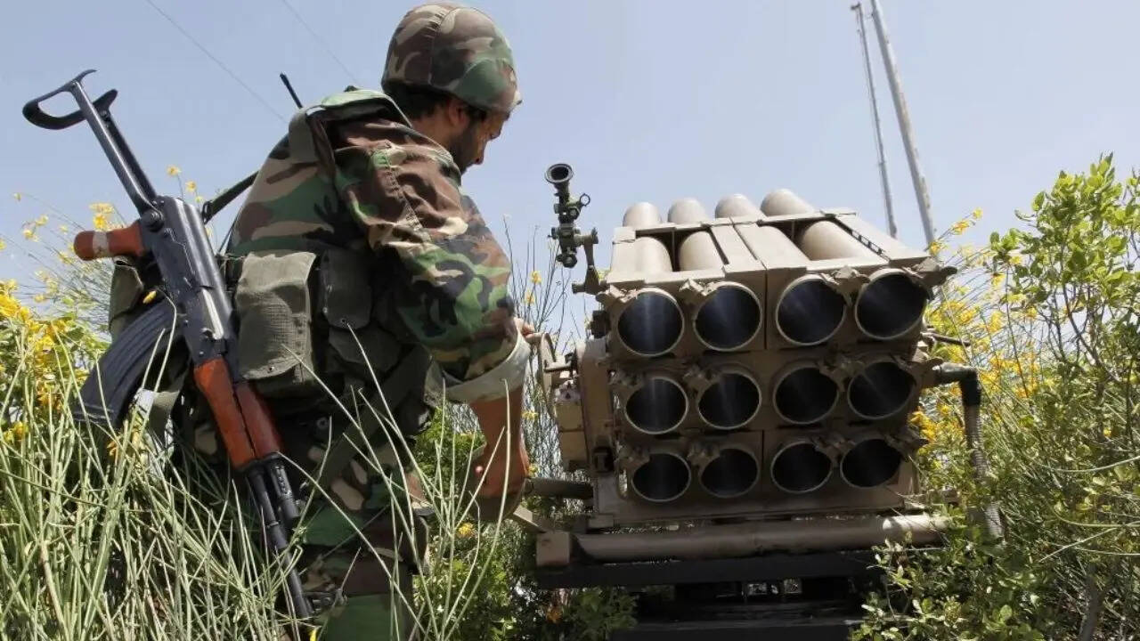 A Hezbollah fighter stands behind an empty rocket launcher, May 22, 2010. (AP photo)