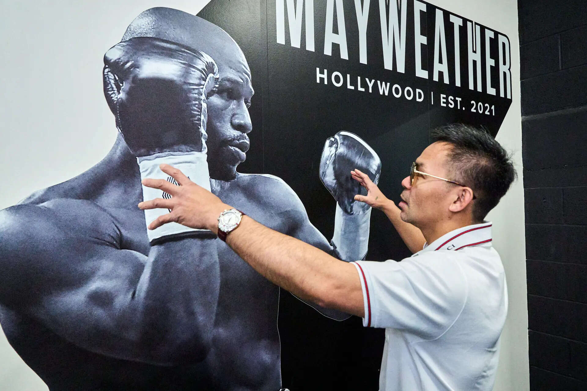 Boxer Manny Pacquiao tours "Pacquiao Prime Boxing," his newly acquired gym, a facility formerly owned by rival Floyd Mayweather Jr., in Hollywood, on Monday, April 6, 2026. (AP Photo/Damian Dovarganes) Box Manny Pacquiao