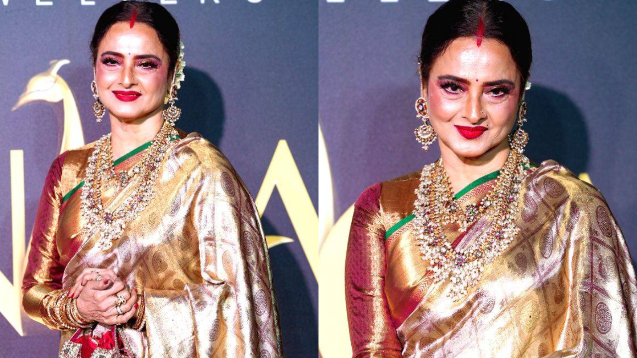 Rekha walks back in gold saree