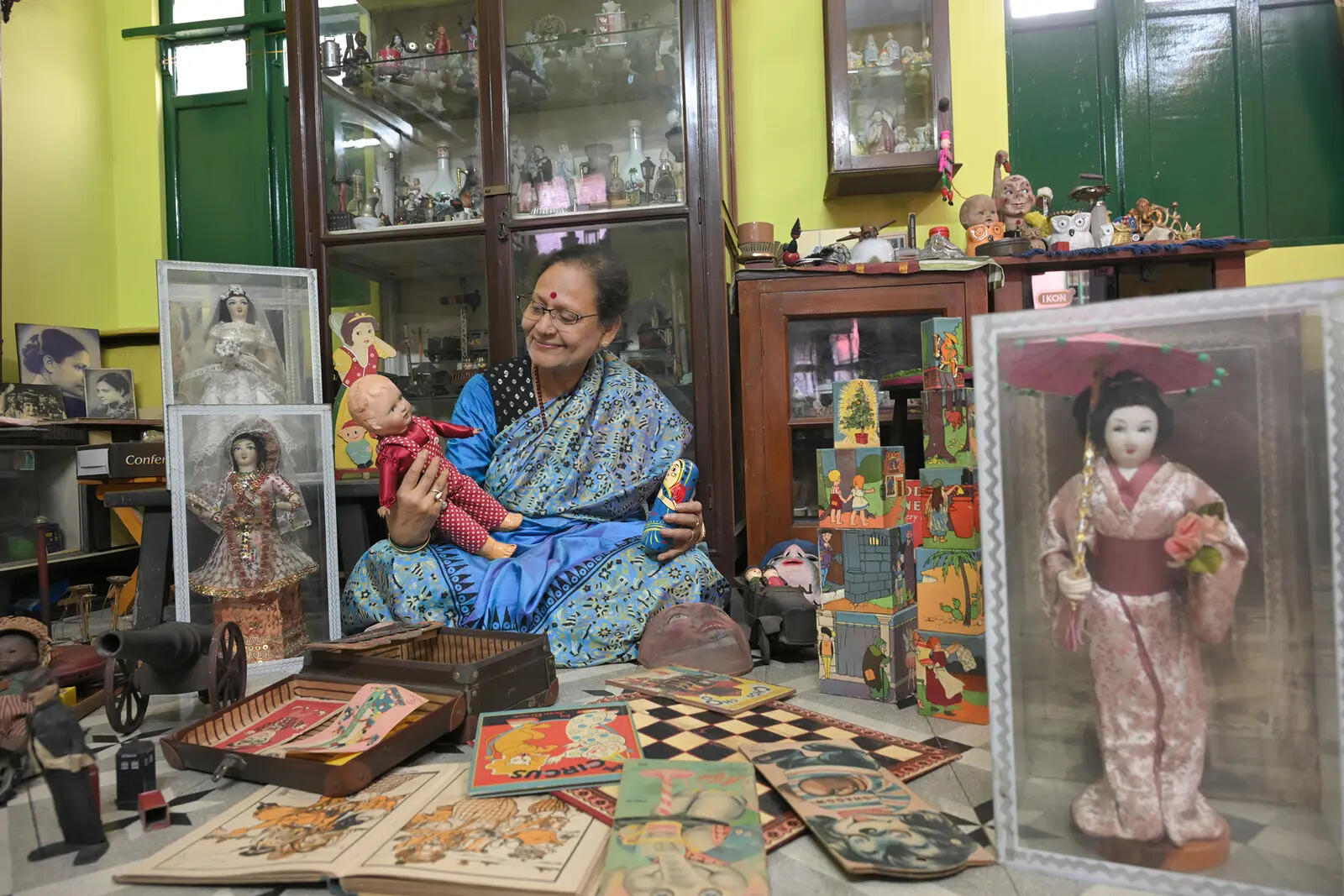 Manju Chatterjee sits amongst her prized vintage possessions
