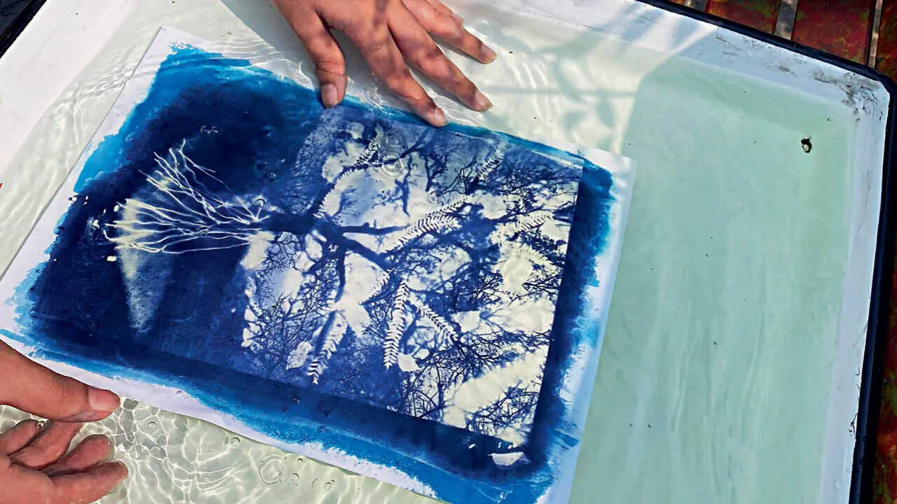 After exposure, the objects are removed, and the print is rinsed under running water. Water locks the impression from developing further.