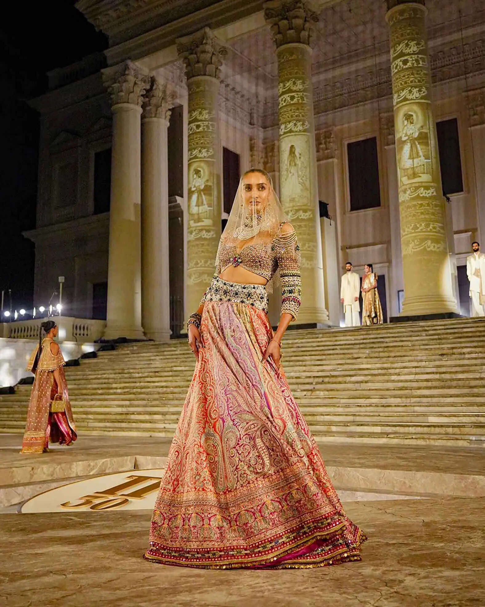 A model walks at the Tarun Tahiliani TT30 anniversary show at the British Residency