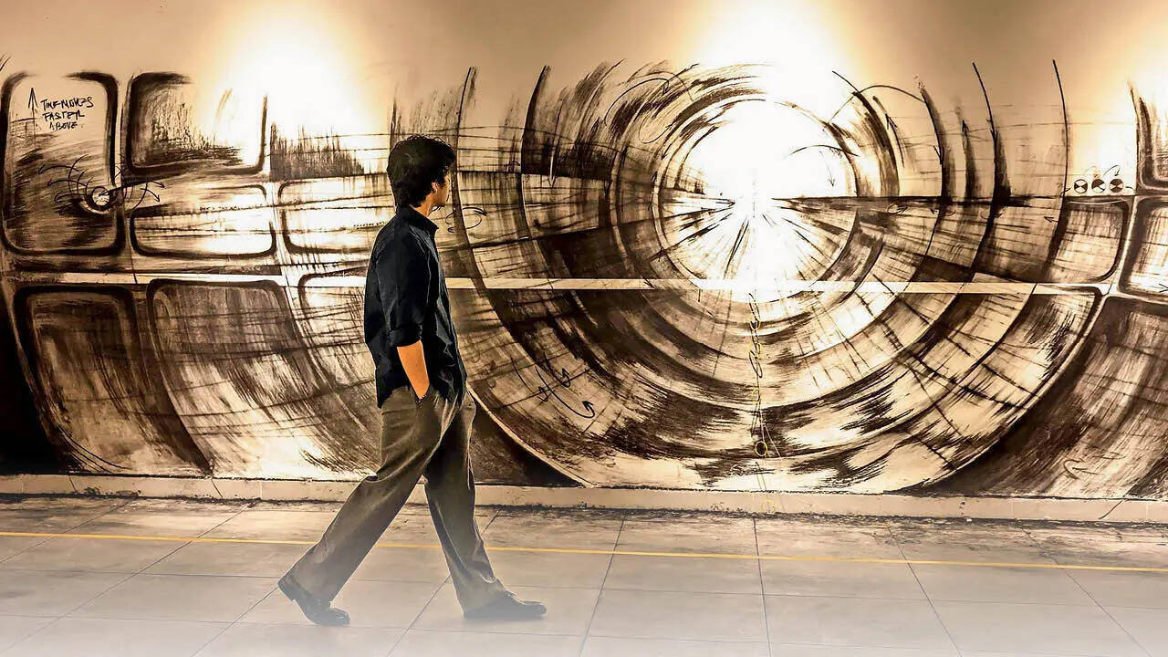 An art lover walks through Method, Def Col, which only showcases emerging artists