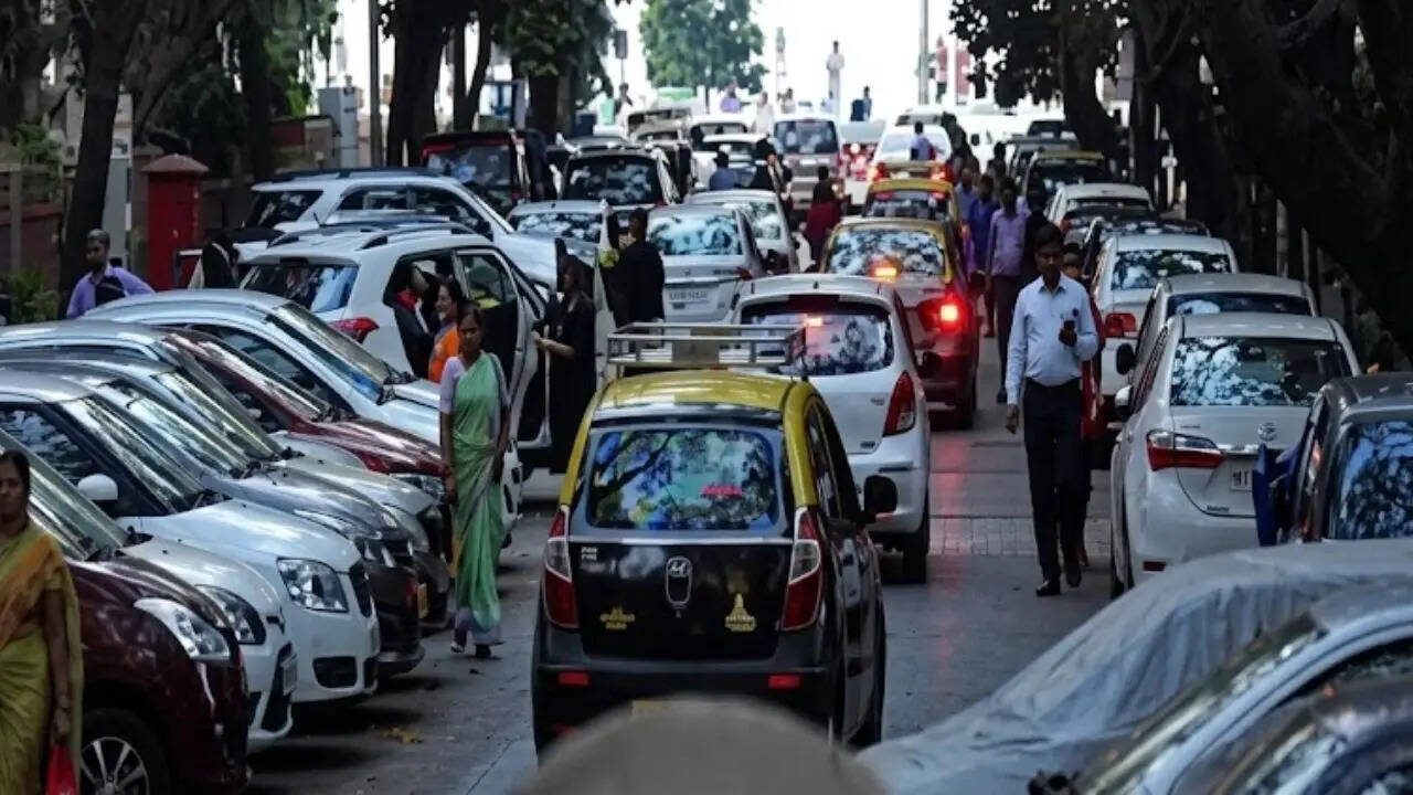 Rush hour with parked cars traffic and bustling streetscape