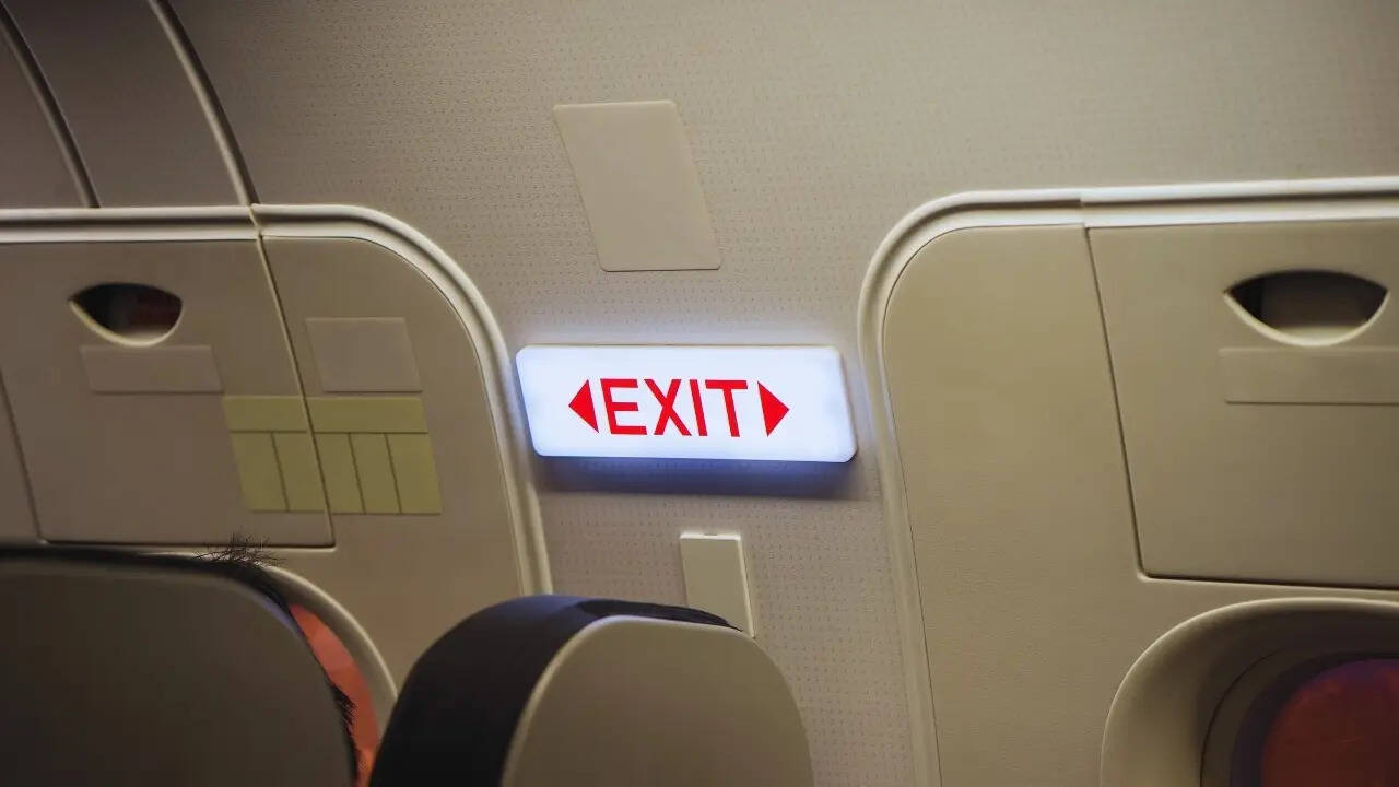 EXIT sign in a passenger airplane