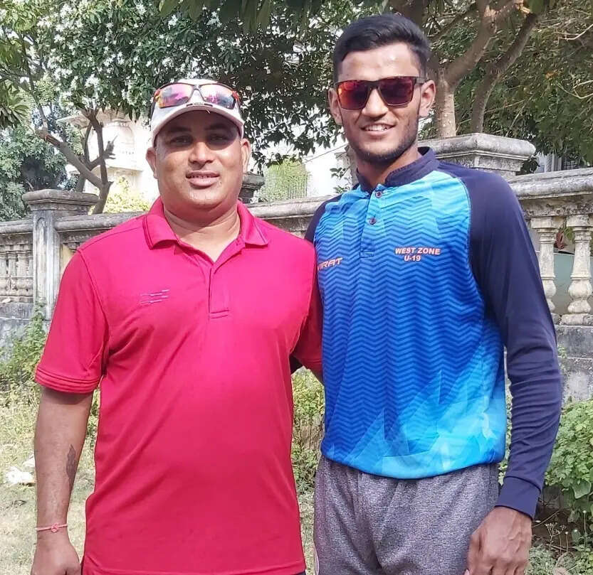 Urvil with his coach Prakash Patani