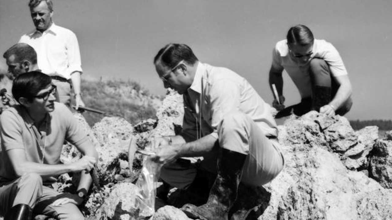 Apollo-era astronauts and geologists examine impact rocks at Germany’s Ries crater during NASA field training for lunar missions in the late 1960s.