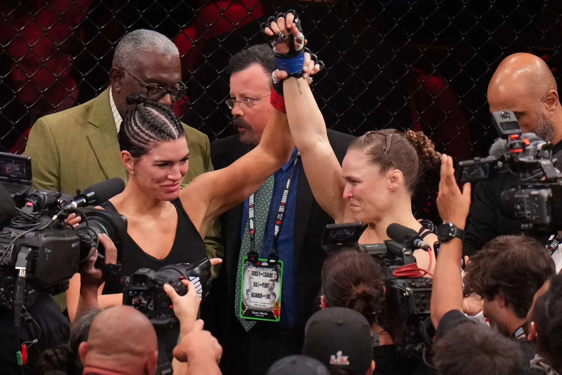 Ronda Rousey and Gina Carano share emotional hug as they fight back tears inside cage