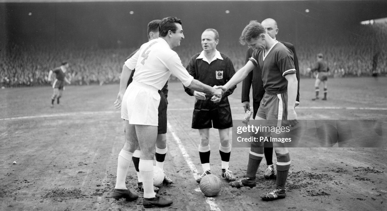 Rival captain Miguel Munoz (left) of Real Madrid and Roger Byrne of Manchester United shake hands before the Kick off of their European Cup Semi-Final second leg match at Manchester. Result was a 2 -2 draw giving Real Madrid a winning aggregate of 5 -3. (Photo by PA Images via Getty Images) Soccer - European Cup Semi Final - 2nd Leg - Manchester United v Real Madrid - Old Trafford, Manchester