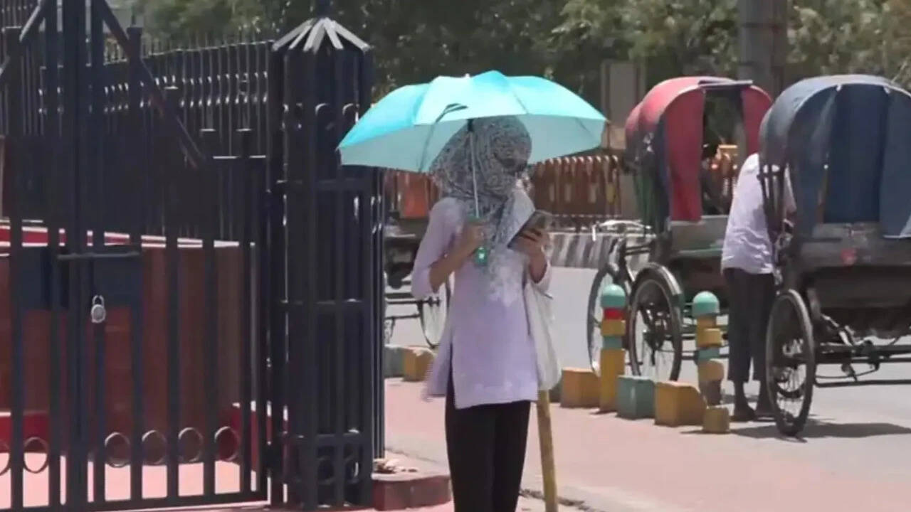 A girl is covered to fight the heat(Photo credit: ANI)