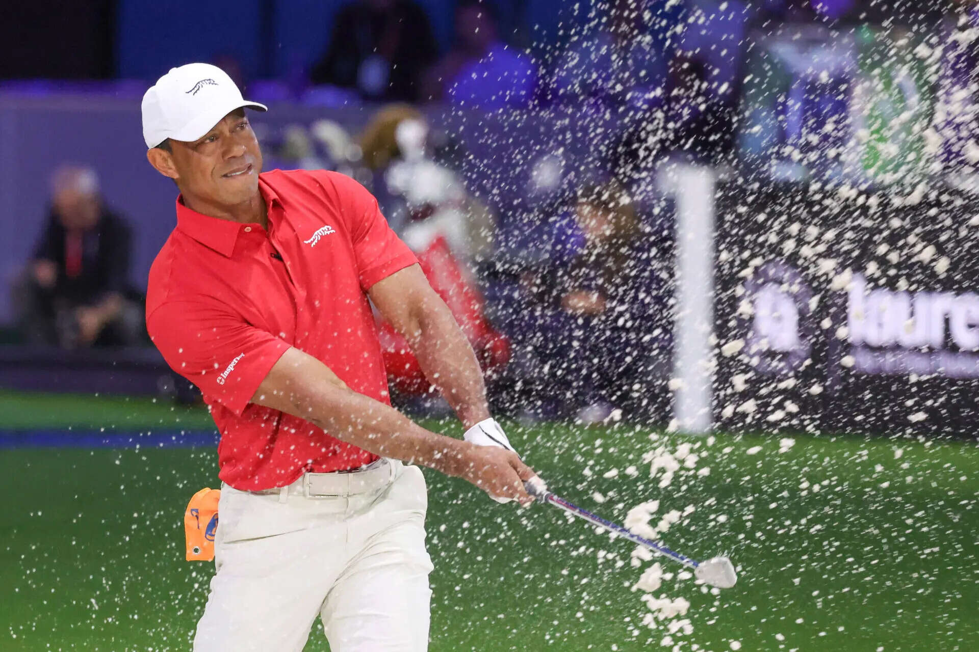 Tiger Woods of the Jupiter Links Golf Club plays a shot from a bunker on the eighth hole, during final day of TGL golf tournament, Tuesday, March 24, 2026, in Palm Beach Gardens Fla. (AP Photo/Reinhold Matay) Tiger Woods arrested on suspicion of DUI after rollover crash, sheriff says