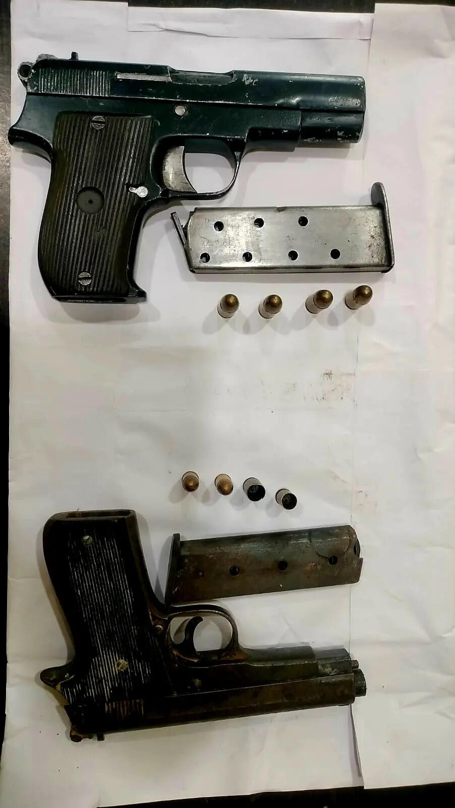 4dd77c59-e4ac-46b6-ba92-355df863ebcf_Recovered_pistols.jpg