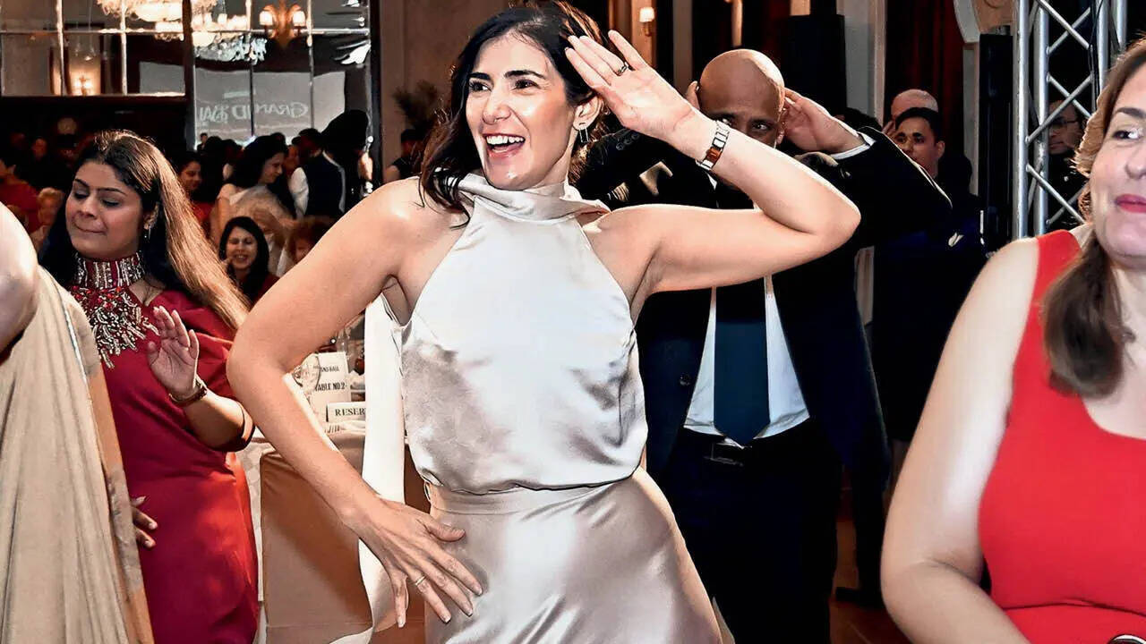 A choreographer led the Macarena before guests took to the floor. (Above) Augistina Flores, wife of the EU Ambassador, joined in A choreographer led the Macarena before guests took to the floor. (Above) Augistina Flores, wife of the EU Ambassador, joined in