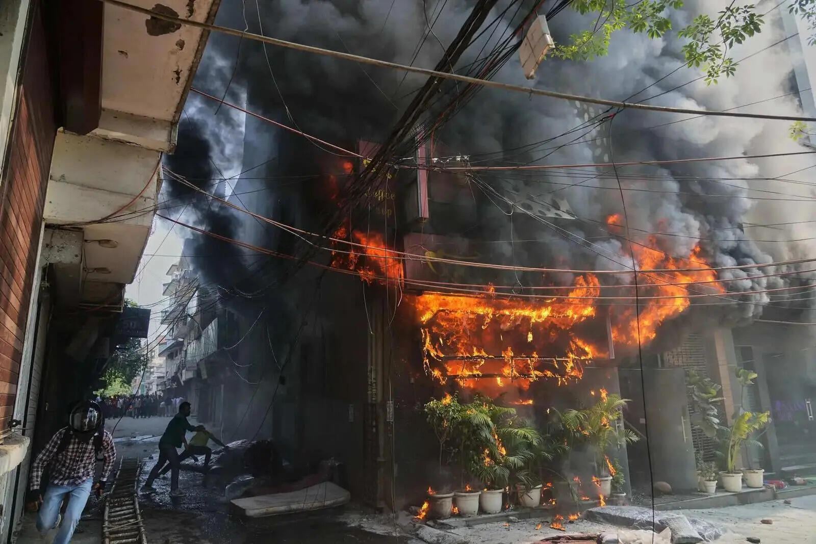 Fire sweeps through a New Delhi building, killing at least 21 people (2).