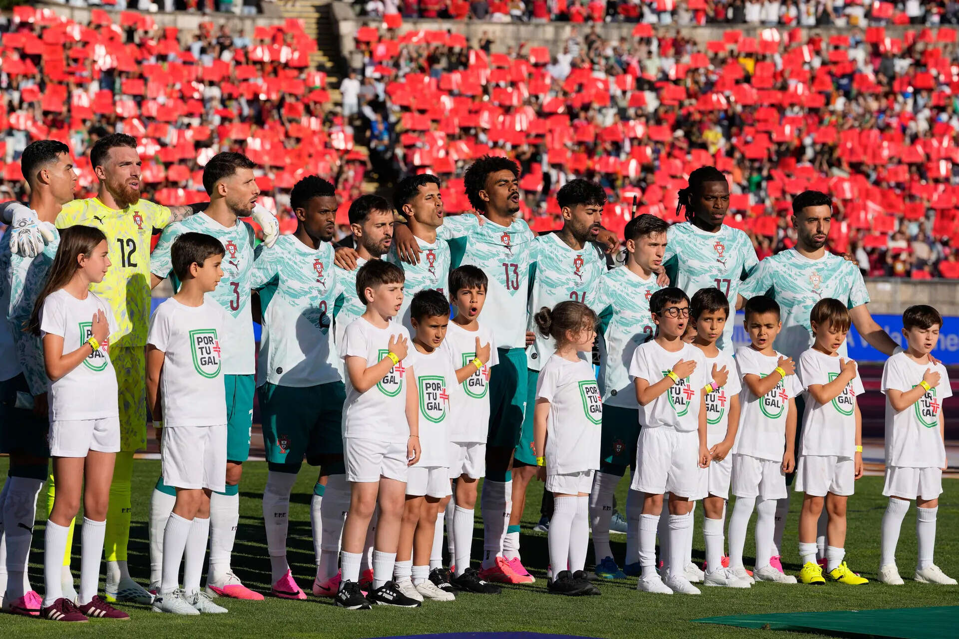Portugal's players sing the national anthem before an international friendly soccer match between Portugal and Chile in Oeiras, outside Lisbon, Saturday, June 6, 2026. (AP Photo/Armando Franca) Portugal Chile Soccer
