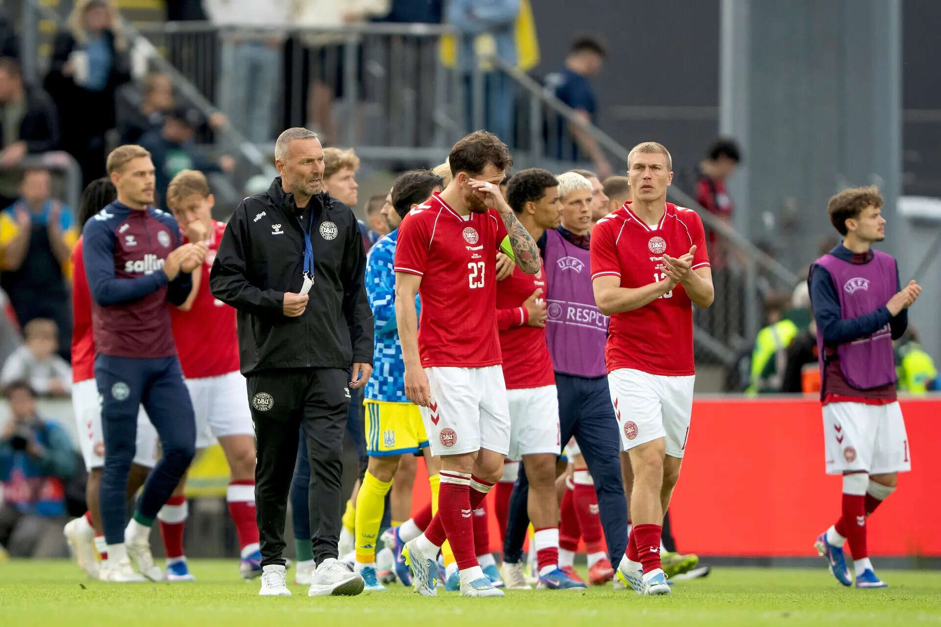 Denmark's Pierre Emile Hoejbjerg, front and his teammates walk on the pitch after the international friendly soccer match between Denmark and Ukraine was cancelled in Odense, Denmark, Sunday, June 7, 2026, after Christian Eriksen has collapsed on the field again while playing for Denmark’s national team. (Bo Amstrup/Ritzau Scanpix via AP) Denmark Ukraine Soccer