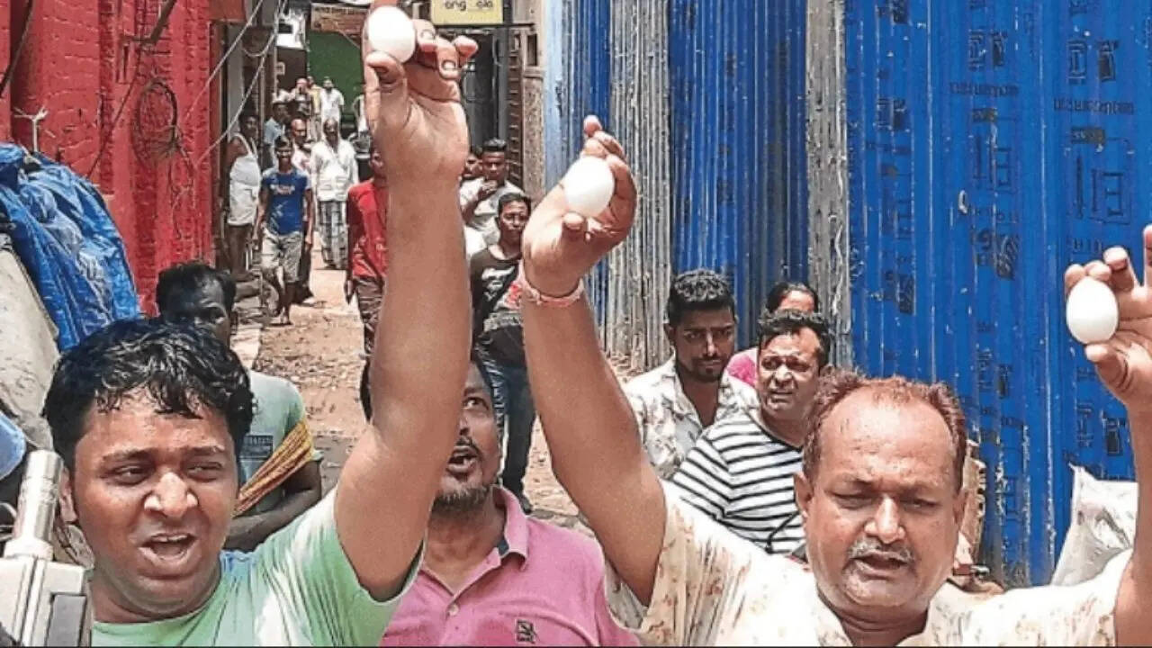 Protesters with eggs near arrested councillor Jasimuddin’s house