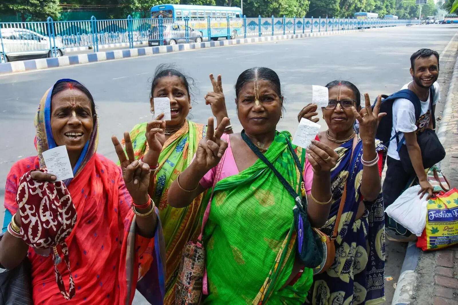 Women passengers show their free tickets