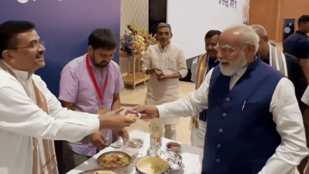 Watch: PM Modi enjoys jhalmuri at NDA meeting served by Bengal CM Suvendu Adhikari