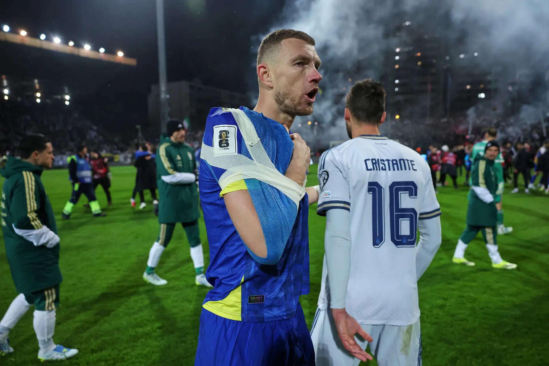 Bosnia's Edin Dzeko, left, greets Italy's Bryan Cristante after a penalty shootout during the World Cup qualifying playoff final soccer match between Bosnia and Italy in Zenica, Bosnia, Tuesday, March 31, 2026. (AP Photo/Armin Durgut) Bosnia Italy WCup Soccer