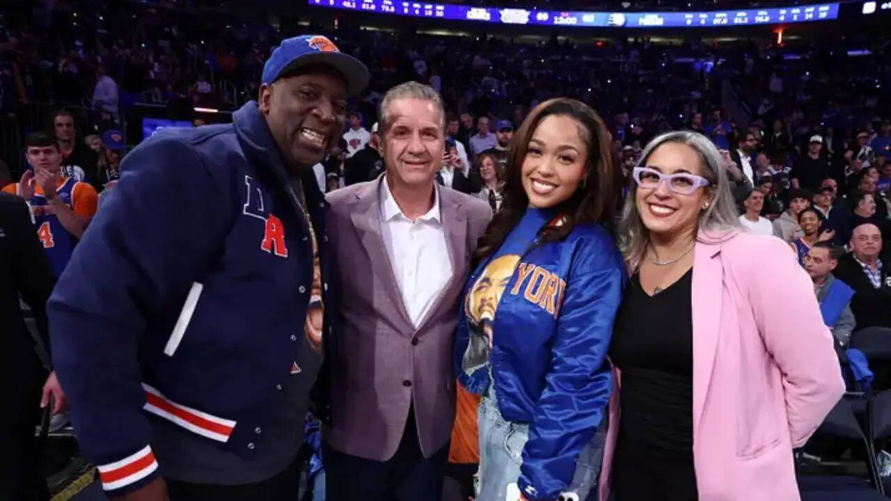 John Calipari alongside Knicks' Karl-Anthony Towns' fiance Jordyn Woods and his father Karl Towns Senior