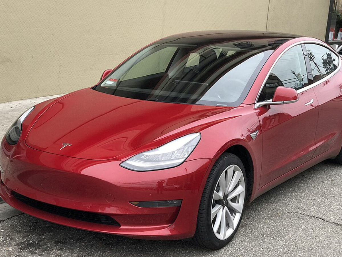 Tesla Model 3 parked, front driver side