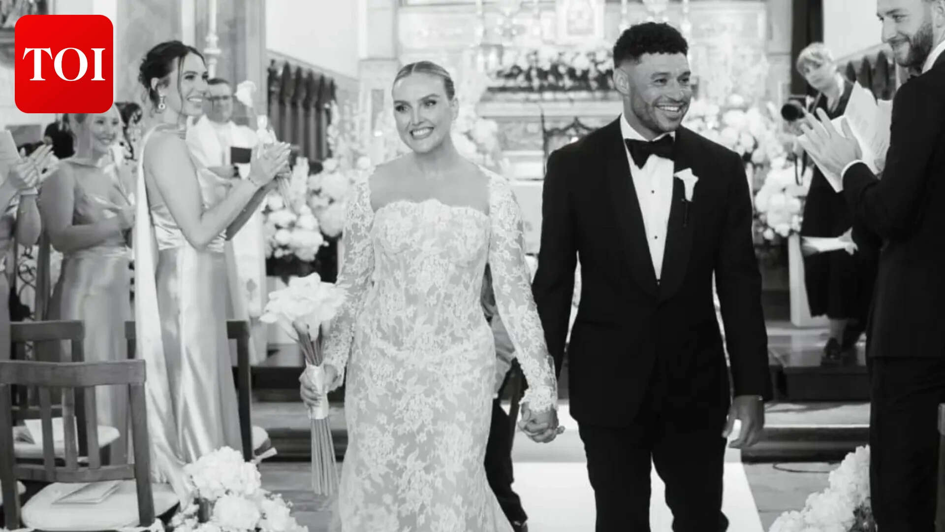 Perrie Edwards and Alex Oxlade-Chamberlain walking down the aisle after exchanging vows Perrie Edwards marries Alex Oxlade-Chamberlain; Singer shares first pics<br><br>